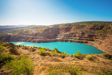 Fototapeta premium Mine quarry of diamond industry. Open cut rock on limestone Kadykovsky quarry, Balaklava, Crimea. 