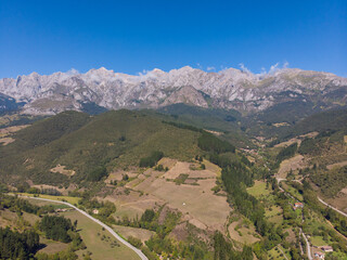 Fototapeta premium Aerial view of the Picos de Europa (Peaks of Europe) a mountain range part of the Cantabrian Mountains in northern Spain.