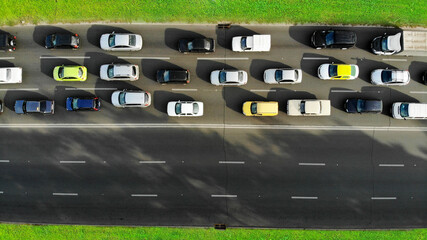 Aerial. Traffic jam with cars on a highway. Peak hour. Top view from drone.