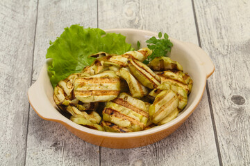 Grilled eggplant slices served basil