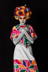 Catrina makeup. Young Mexican woman with typical costume.