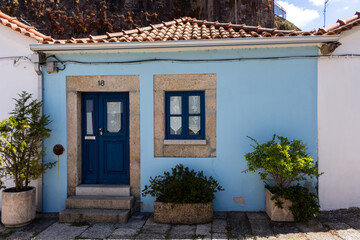 Vila Nova de Cerveira / Portugal - August 1, 2020: Traditional small blue house in the center of the village.