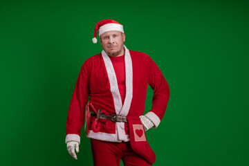 Santa Claus poses on a green chrome background