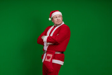 Santa Claus poses on a green chrome background