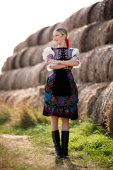 Young beautiful slovak woman in traditional costume. Slovak folklore.