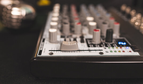Close-up of main control fader of music studio mixer.