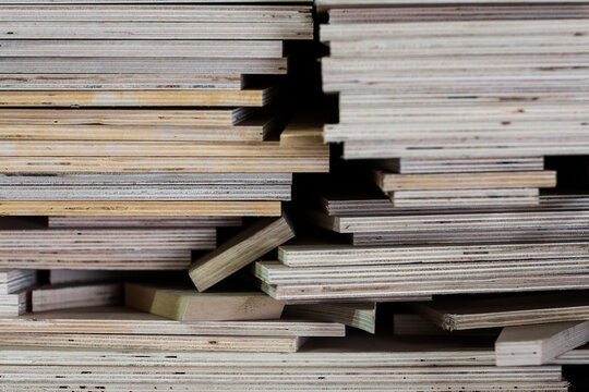 A large stack of plywood boards on top of each other