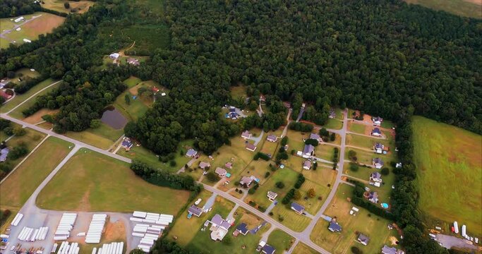 Passing over Burlington, NC we fly over the Alamance County Agriculture Fair location that is covered in truck trailers. Surrounded by single family homes and mobile homes.  Alamance County Ag Fair.