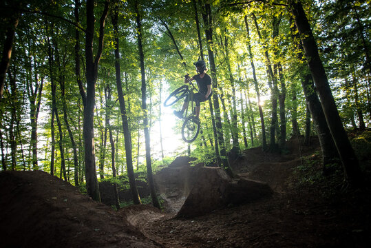 Mountain biker jumping ona dirt jump bike