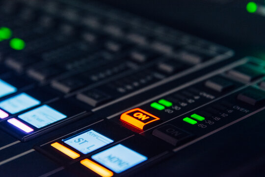 Buttons and LED lights on a audio mixer board