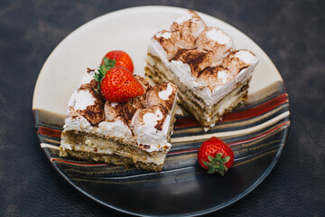 Homemade Tiramisu cake is a traditional Italian dessert with strawberries. Sweet dessert for Breakfast. Calories and excess weight