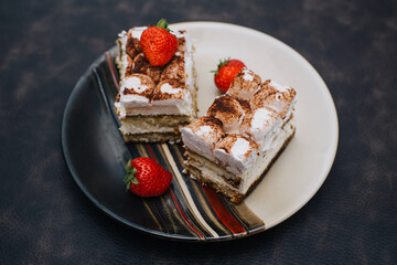 Traditional Italian dessert tiramisu with strawberry, selective focus image