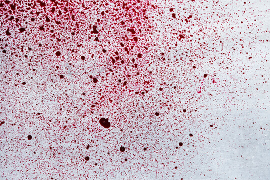 Red beet sauce drops on tray