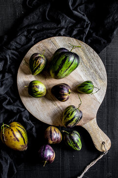 Pear-melons on a cut board