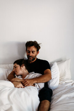 Man and woman in bed