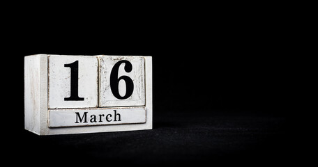 March 16th, Sixteenth of March, Day 16 of month March - white calendar blocks on black textured background with empty space for text.