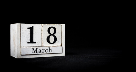 March 18th, Eighteenth of March, Day 18 of month March - white calendar blocks on black textured...