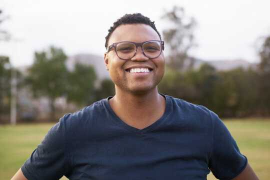 Happy confident black man in a park