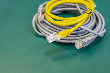 pair of lan wires with rj45 connector gray and yellow, engineering background