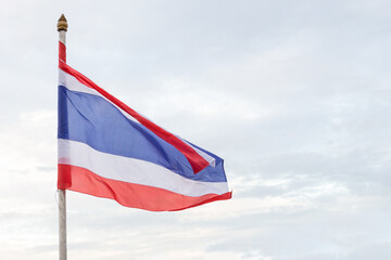 developing the flag of Thailand with a red, red and white stripe against a bright sky