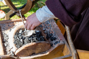 coal smithy forge, preparation for the furnace of iron close-up