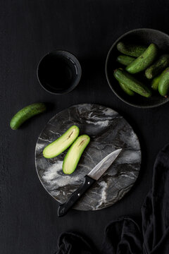 Cocktail avocado on a cut board