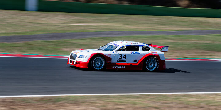 Touring car Audi Mitjet racing in action on circuit blurred background