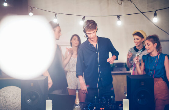Deejay Playing Music at Outdoor Party