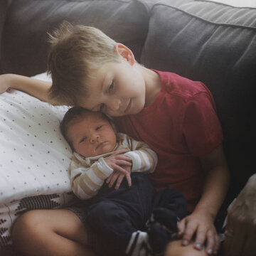 Big brother bonding with his new baby bother