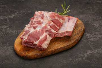 Raw pork ribs served rosemary