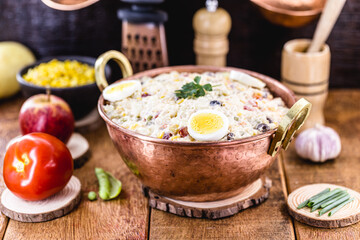 Brazilian mayonnaise, with fruits and vegetables, rustic kitchen, wooden utensils in the background