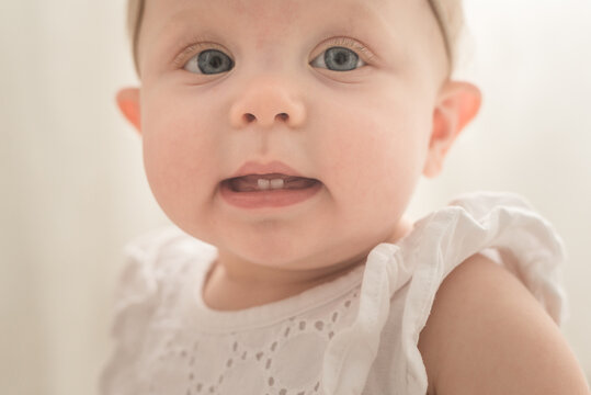 A Baby Girl And Her First Teetch