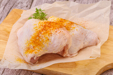 Raw chicken thigh with spices