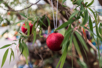 xmas ball hanging in a gum tree, outdoor decorations like this a