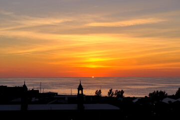 Fototapeta na wymiar Bermuda harbor silhouette with a beautiful orange sunset. 