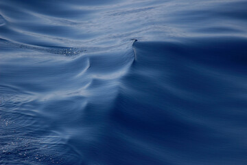 Beautiful reflection of the sky on the blue sea.