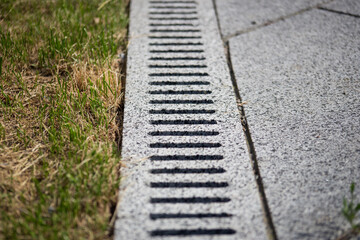 Storm drain for rain and ground water from impervious surfaces