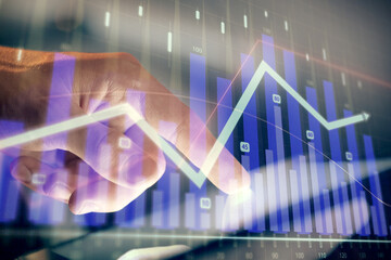 Multi exposure of man's hands holding and using a phone and financial chart drawing. Market analysis concept.