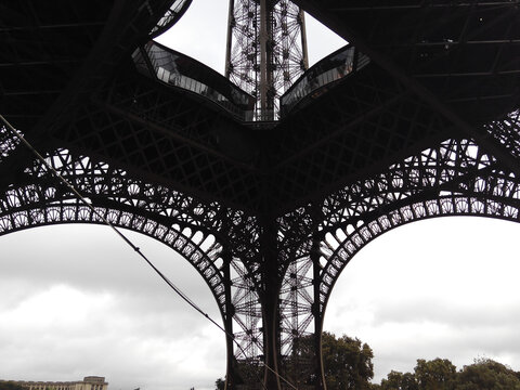 Basement of the Eiffel tower in a cloudy day