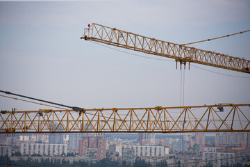 Tower crane at a construction site in the city