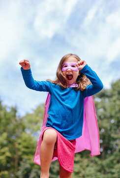 Cute young girl in a superhero outfit