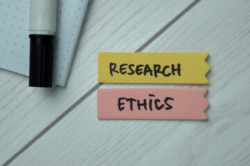 Research Ethics text on sticky notes isolated on office desk
