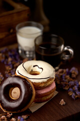 The sweet glazed donuts stacked on the table