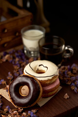 The sweet glazed donuts stacked on the table