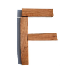The letter F made of wood blocks on a white background board