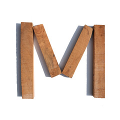 The letter M made of wood blocks on a white background board