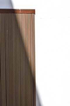 Striped pattern on white wall.