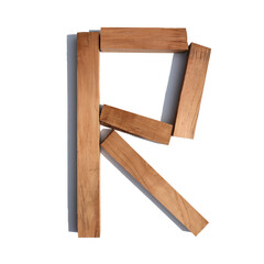 The letter R made of wood blocks on a white background board