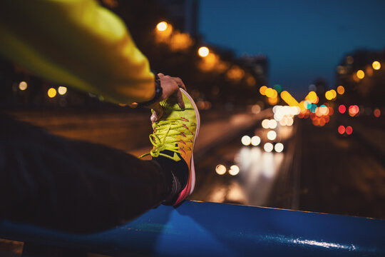 Unrecognizable athlete stretching on bridge - Powered by Adobe