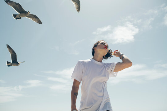 Woman walking with birds